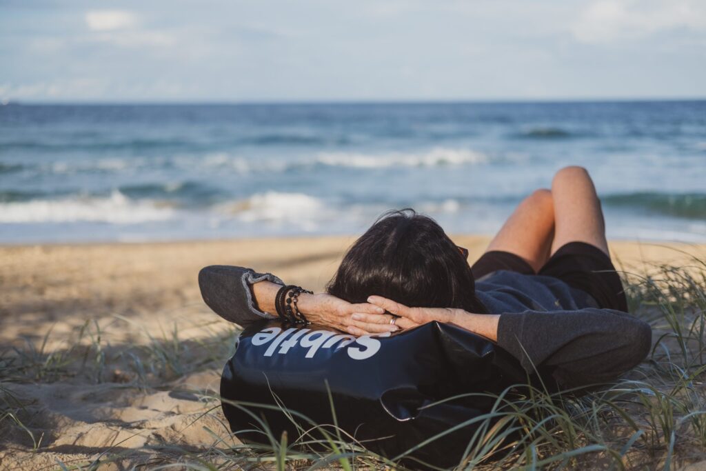 woman napping on a beach