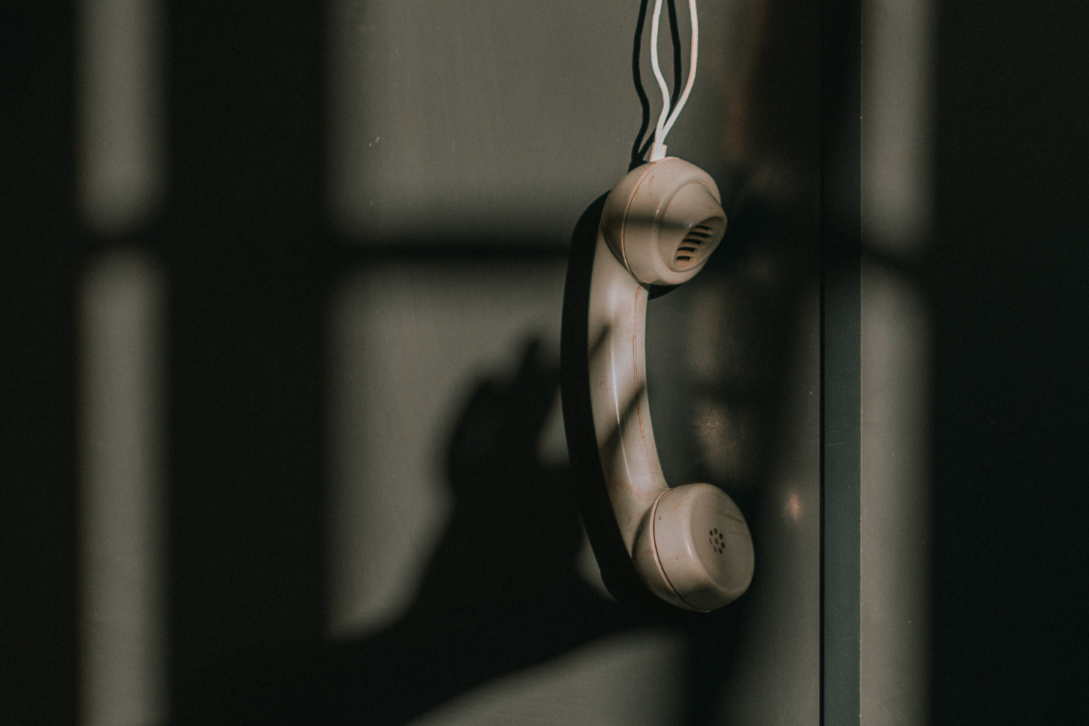 a phone hanging off the hook