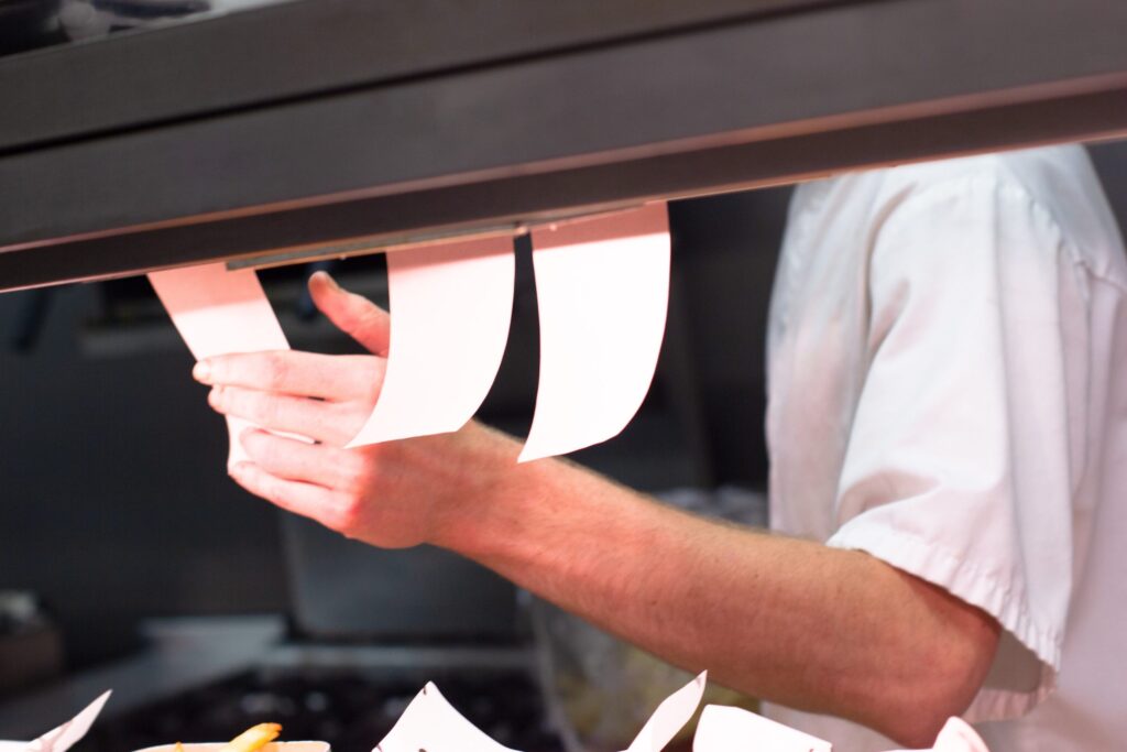 tickets in a restaurant kitchen queued up