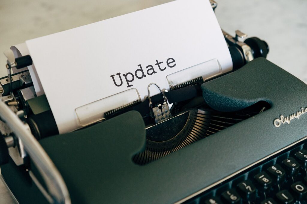 a typewriter with a document reading simply 'update'