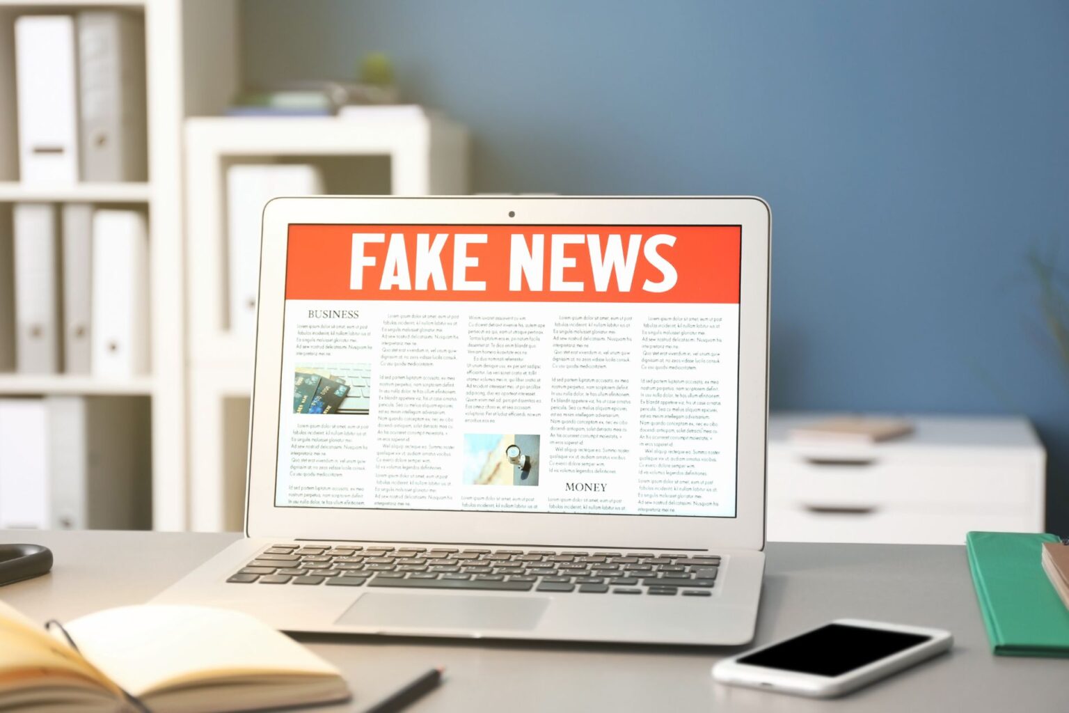 a laptop reading 'fake news'
