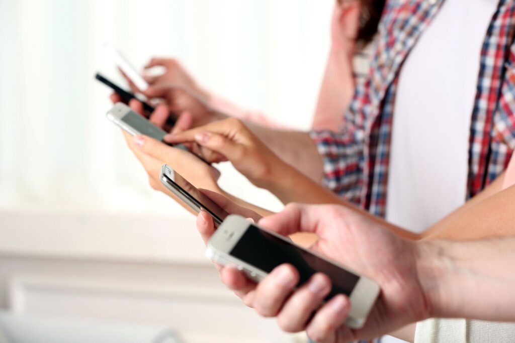 a group of people all with different mobile phones
