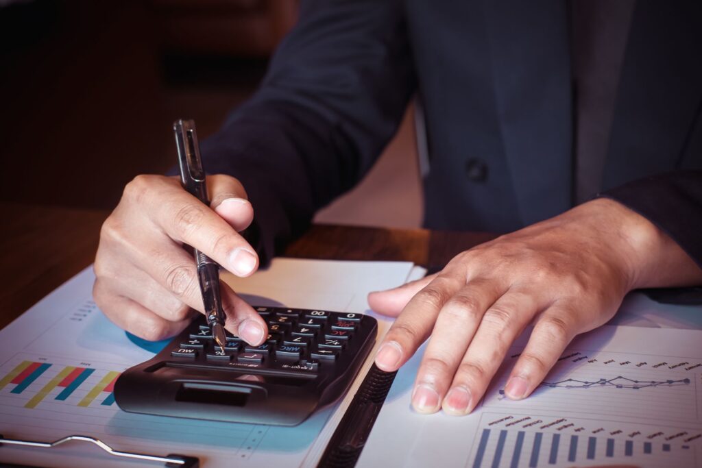 an employee uses a calculator to make supplier purchase decisions